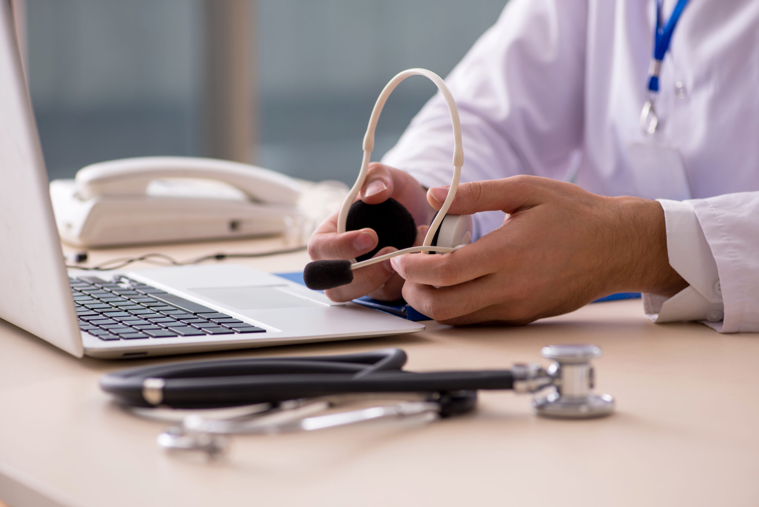 Young male doctor in telemedicine concept Young male doctor in telemedicine concept